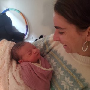 Midwife Judy Ribner, DNP, CNM of Holistic Midwifery New York with a newborn baby