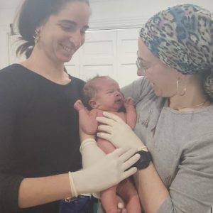 Long Island and New York Home Birth Midwives Judy Ribner , DNP, CNM and Malki Schuler , MSN, CNM, C-EFM, LCCE with New Baby Born At Home